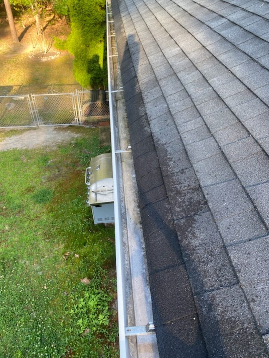 Same gutter run completely cleared after hand-scoop and flush