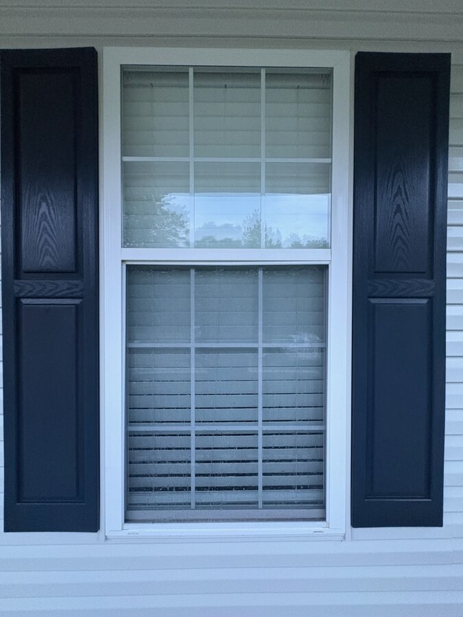 Window and shutters after soft washing — bright and clean